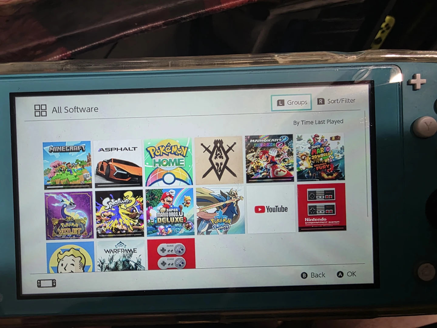Nintendo Switch Lite Turquoise with 4 Games - photo 3