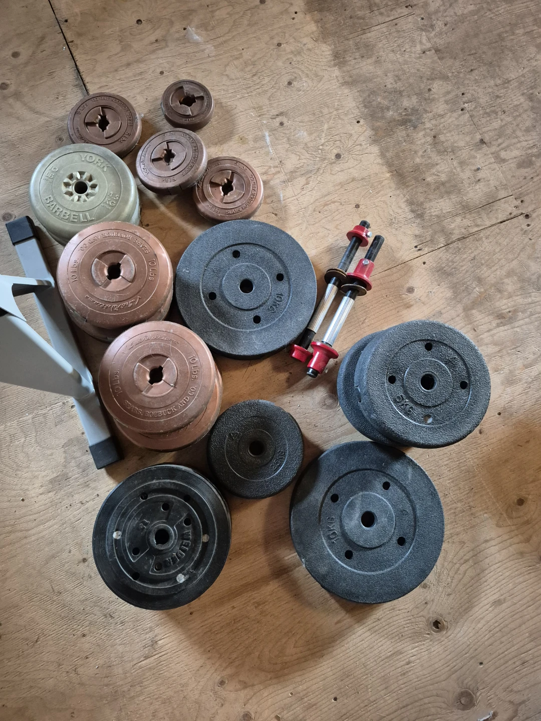 Assorted Weight Plates and Dumbbell Handles