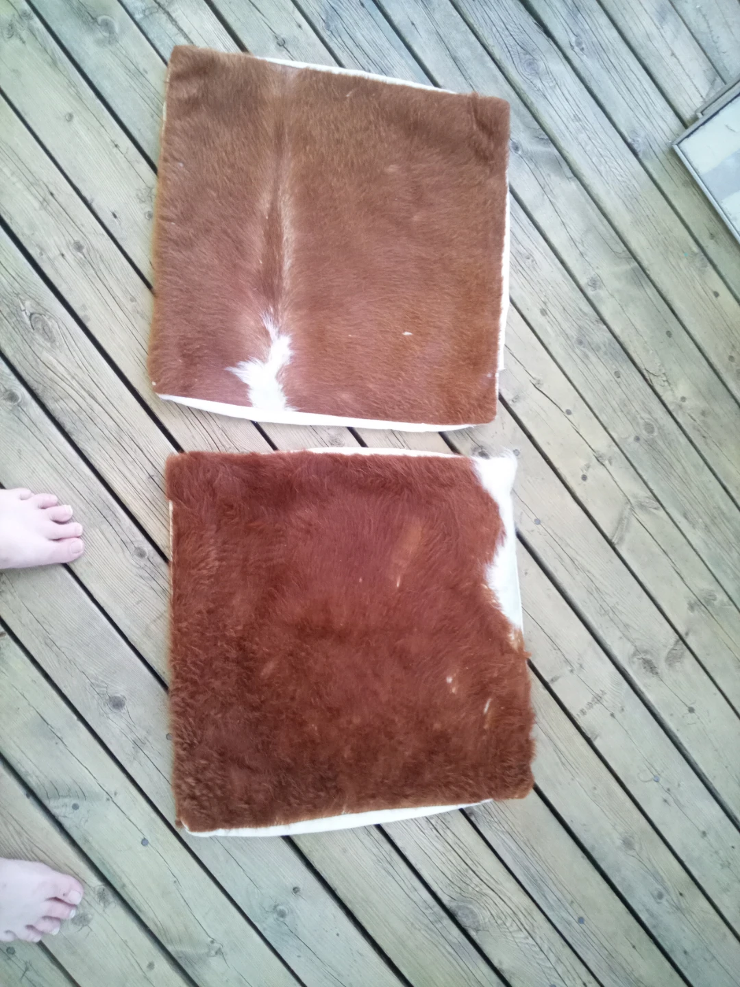Two Brown and White Cowhide Cushion Covers