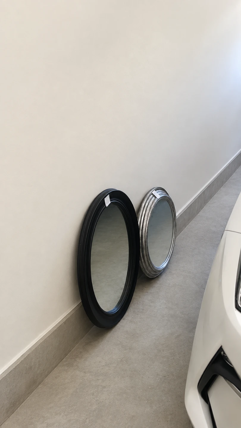 Two Oval Wall Mirrors