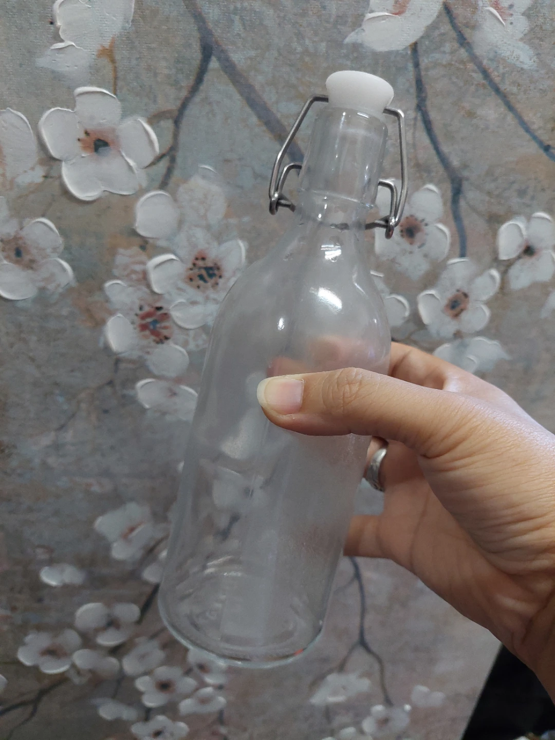 Clear glass flip-top bottle