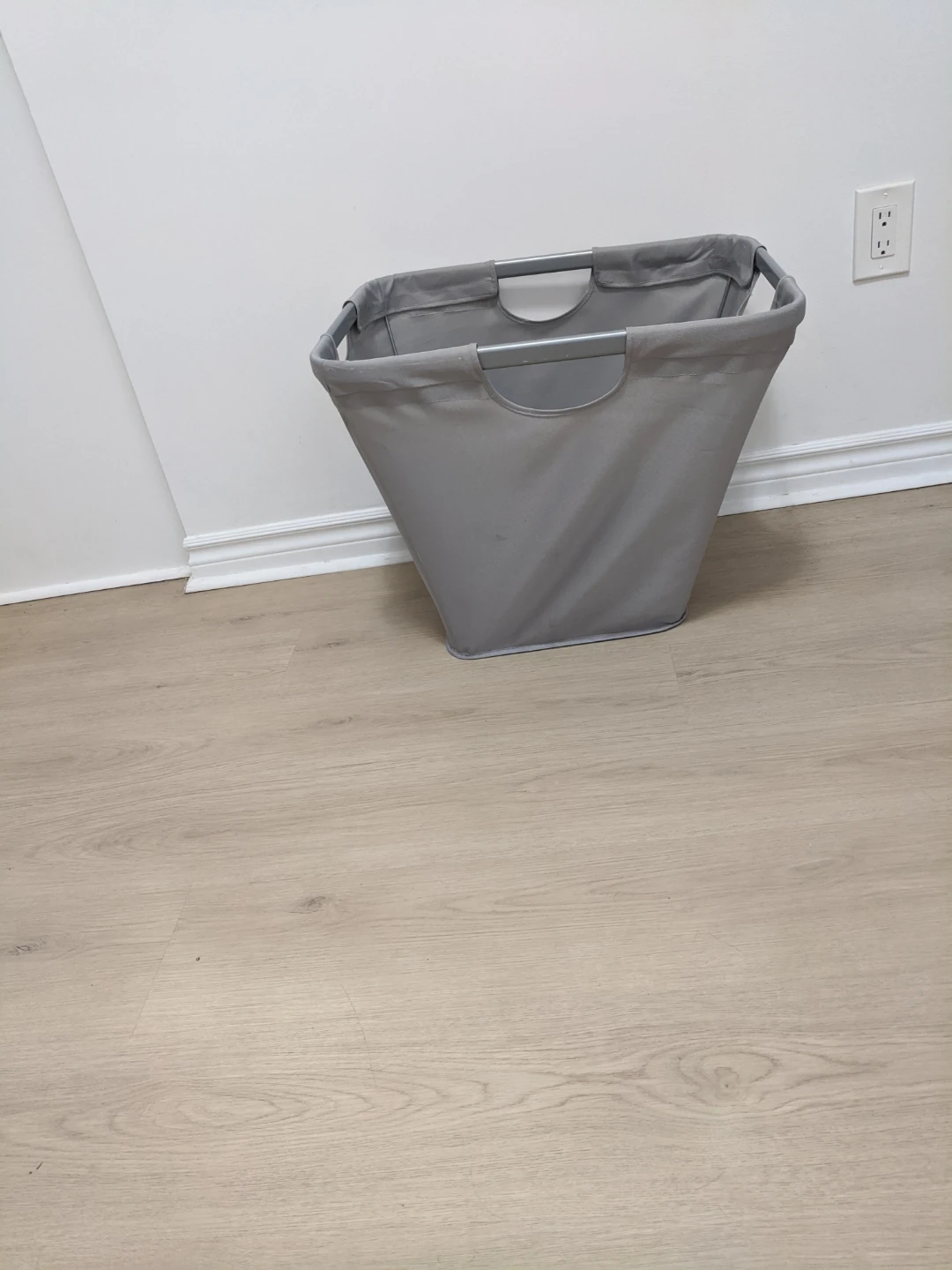 Grey laundry hamper with metal frame
