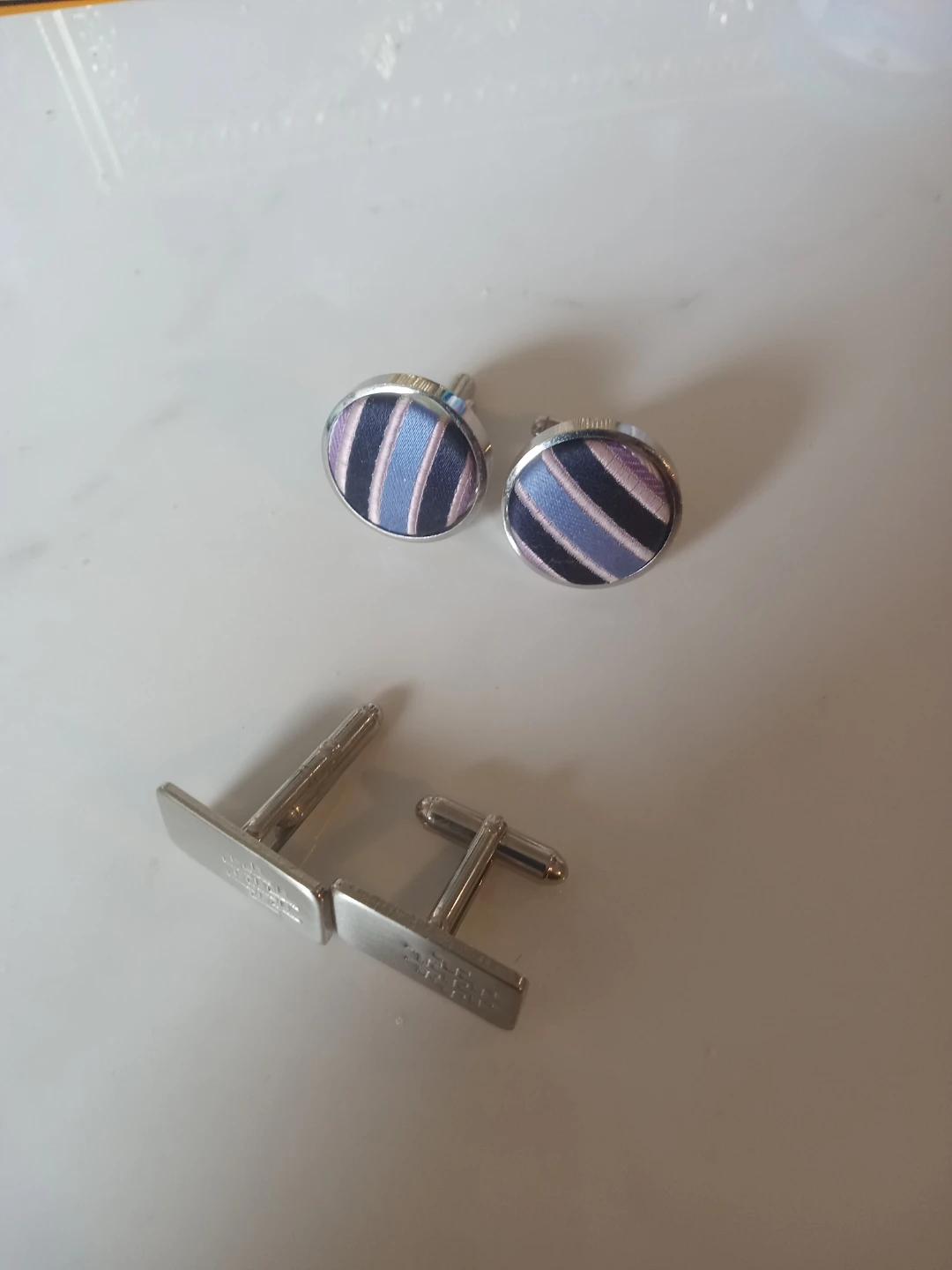 Two pairs of men's cufflinks
