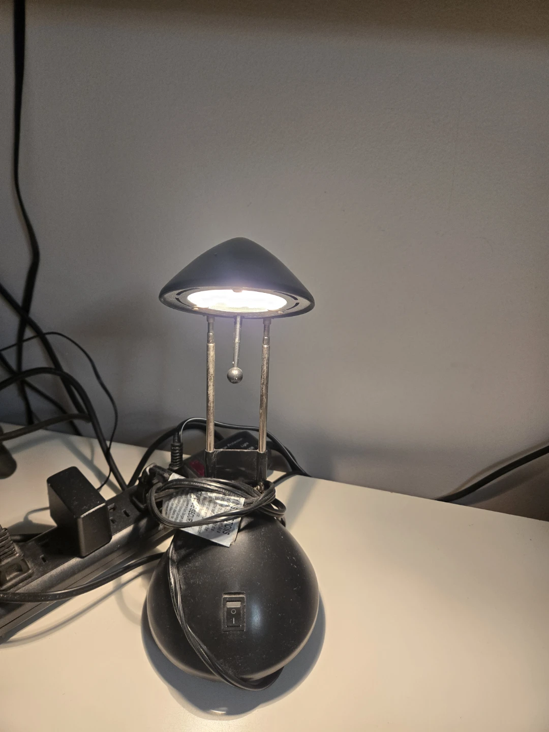 Two adjustable black desk lamps