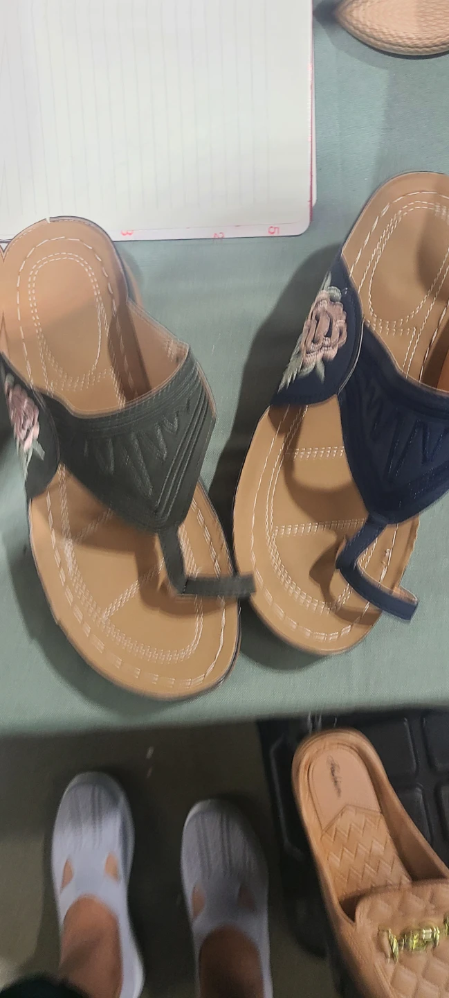 Various assorted women's summer sandals and slides