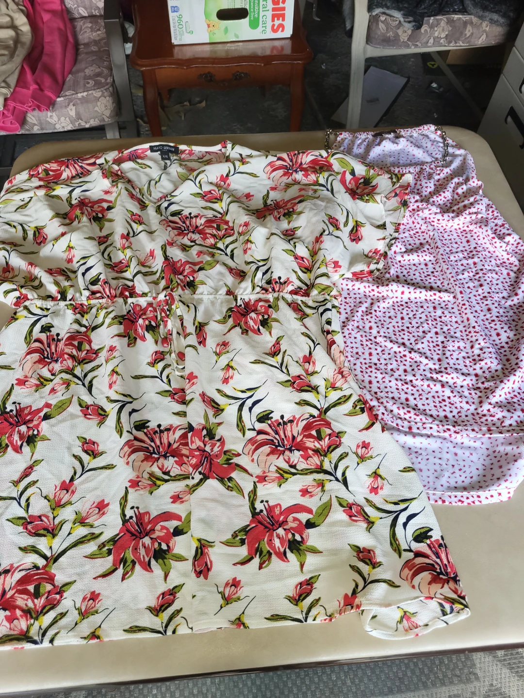 2 woman's shirts