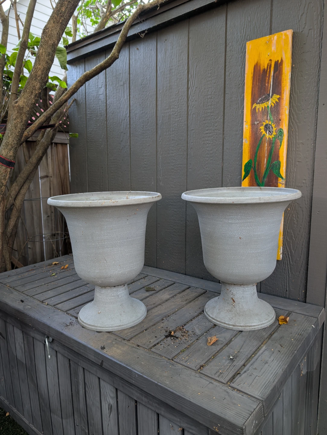 Set of two grey, resin garden urn planters