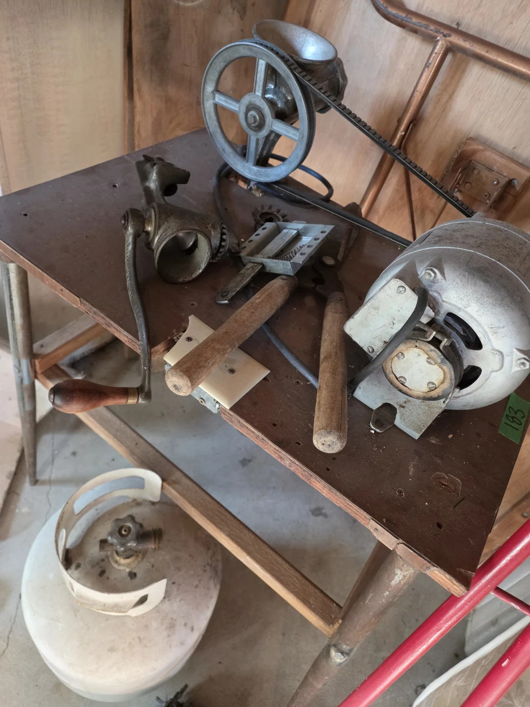 Vintage manual meat grinder and electric motor setup