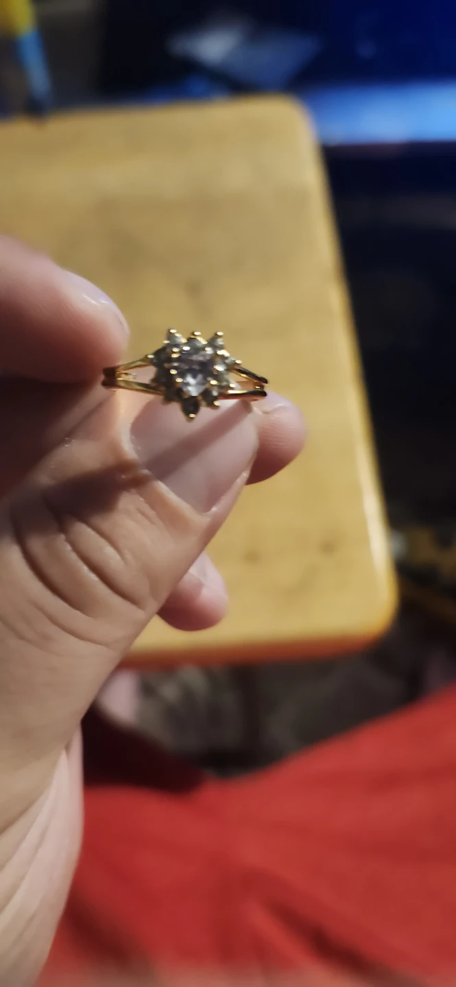 Gold-tone ring with clear stone