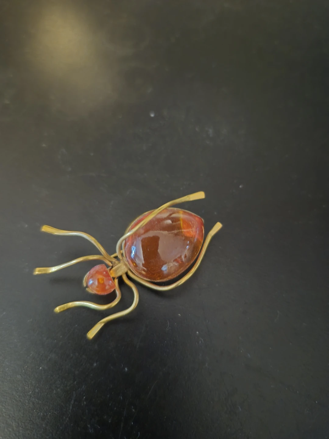 Amber spider brooch