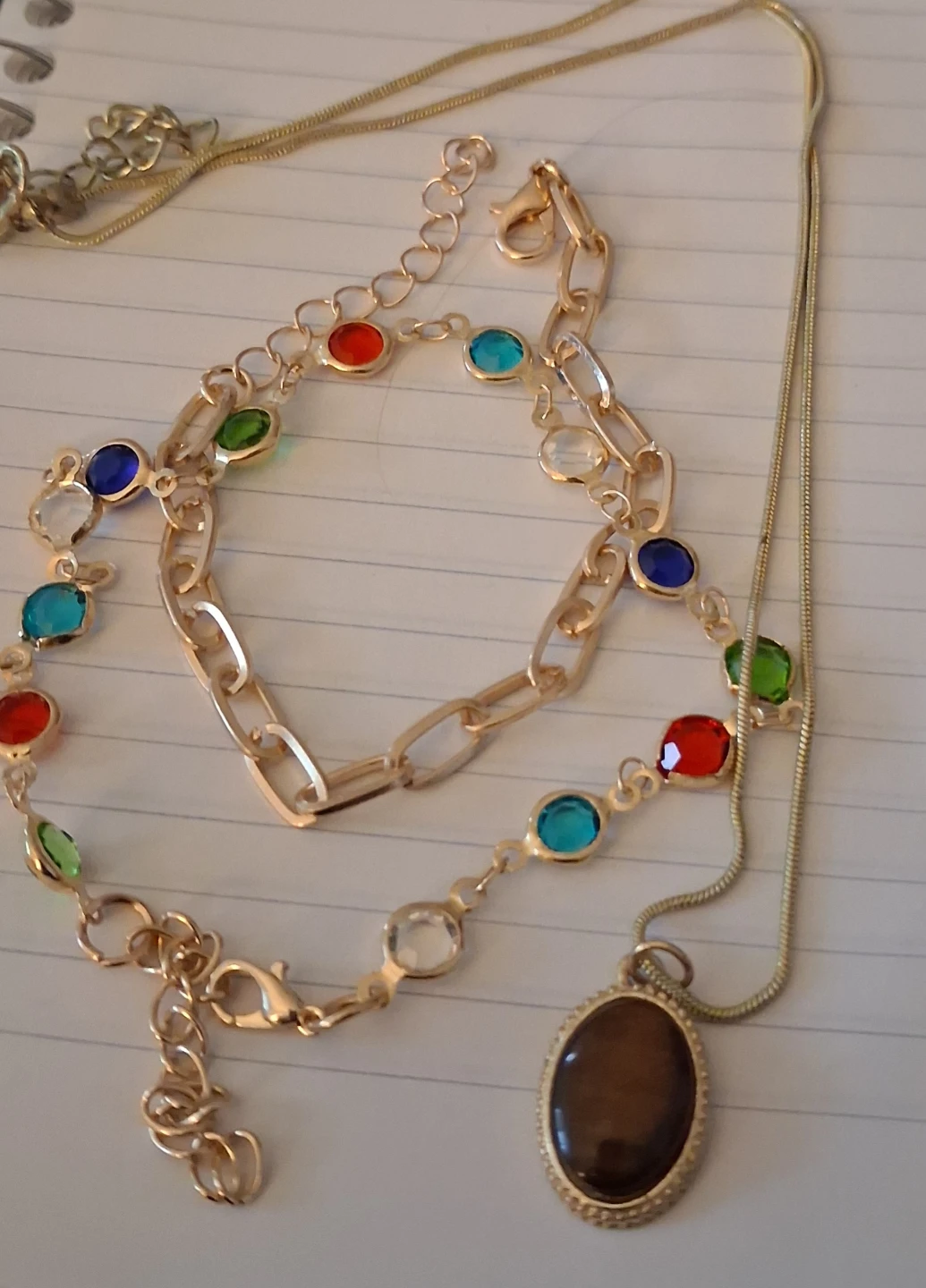 Gold-tone chain bracelete with colourful gemstones