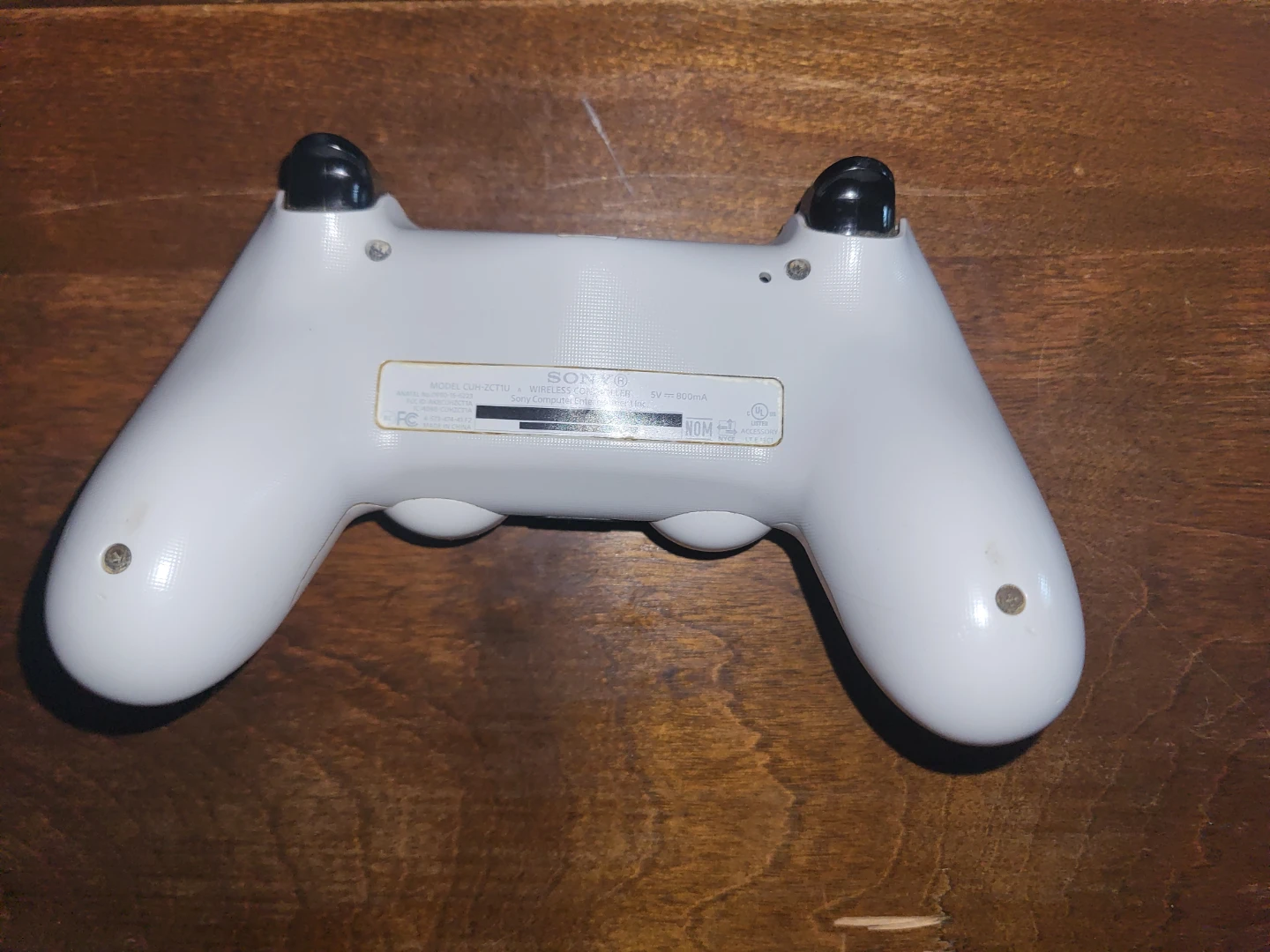 Used White PS4 Controller. - photo 2