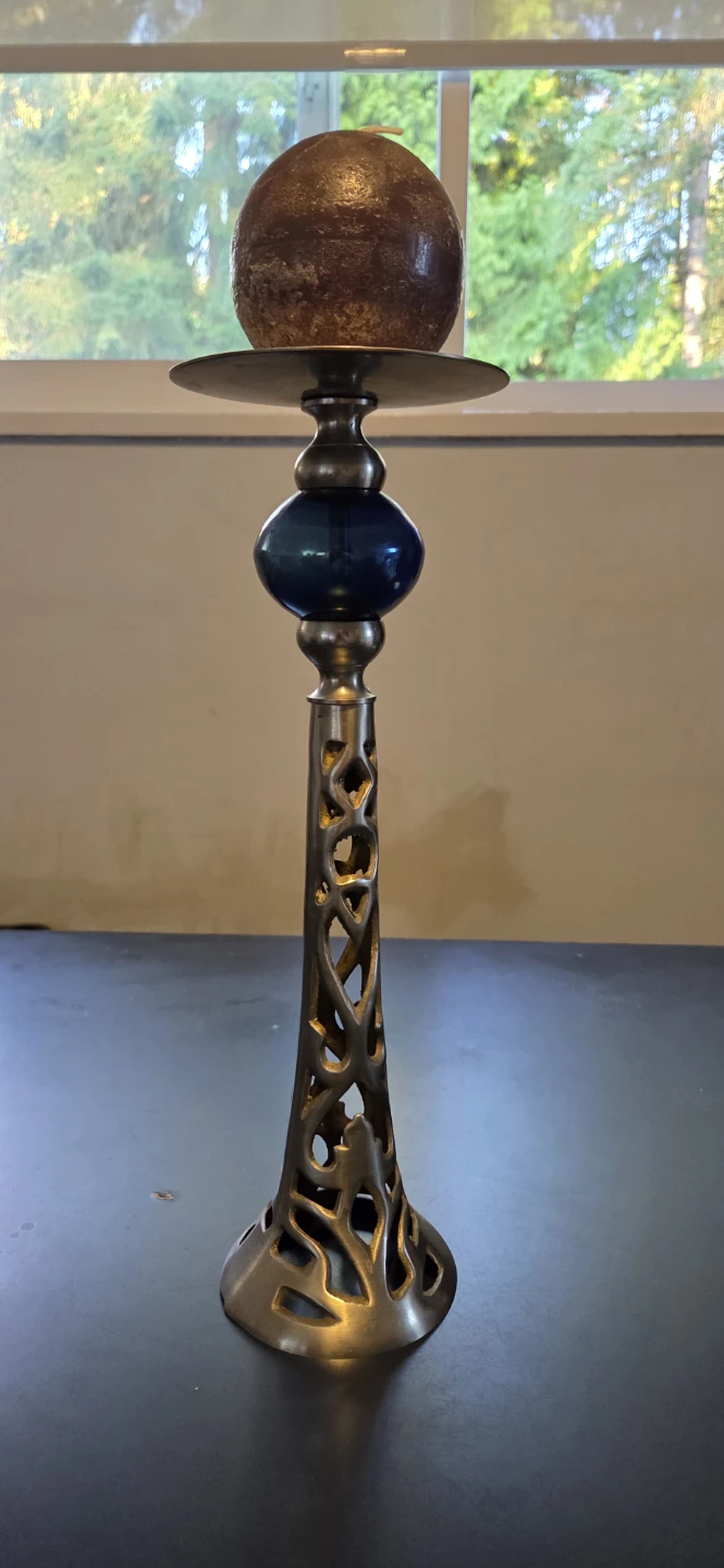 Metal and blue glass pillar candle holder