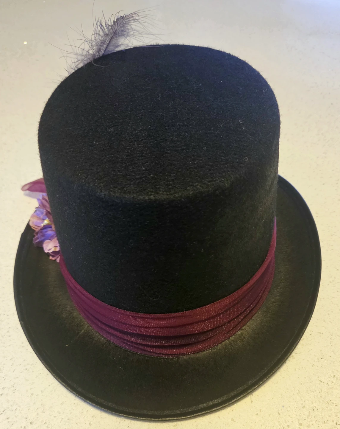 Black top hat with feather and floral trim - photo 3