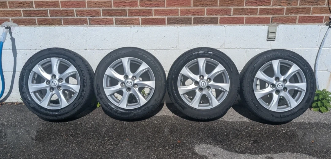 Set of 4 Mazda alloy wheels with Goodyear tires