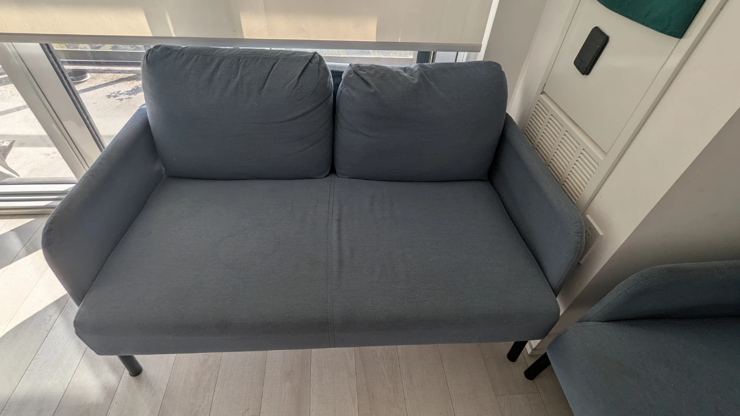 Set of two blue fabric loveseats