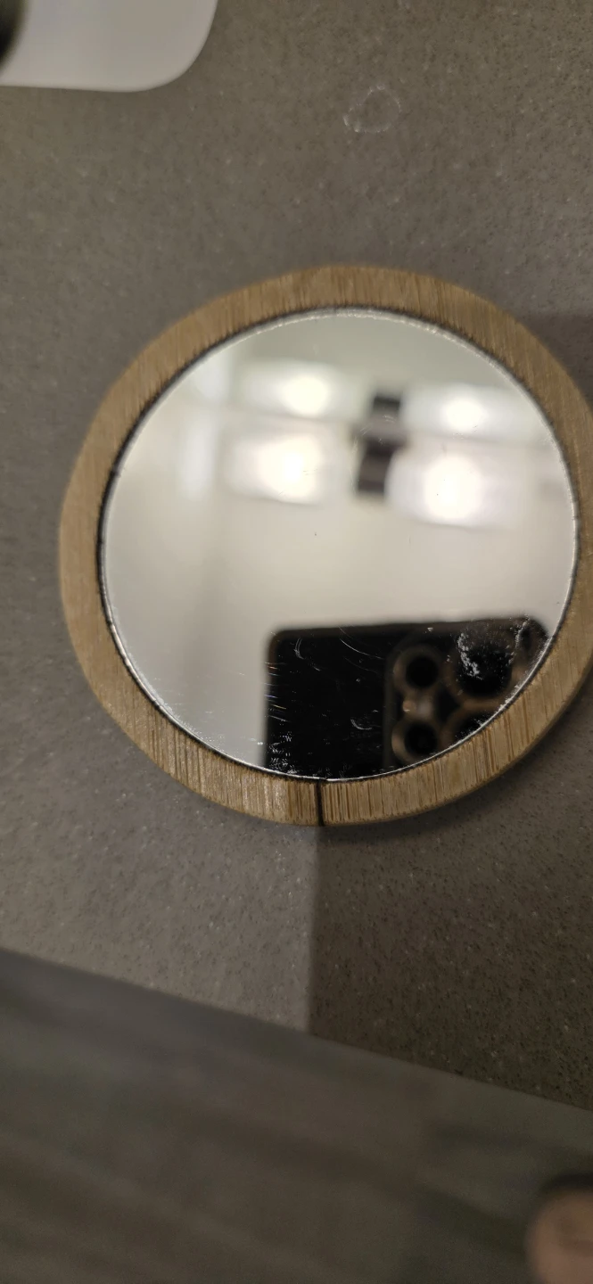 Small circular bamboo-framed mirror 🏈