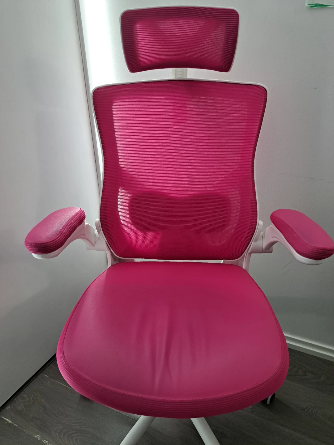 Pink ergonomic office chair with headrest