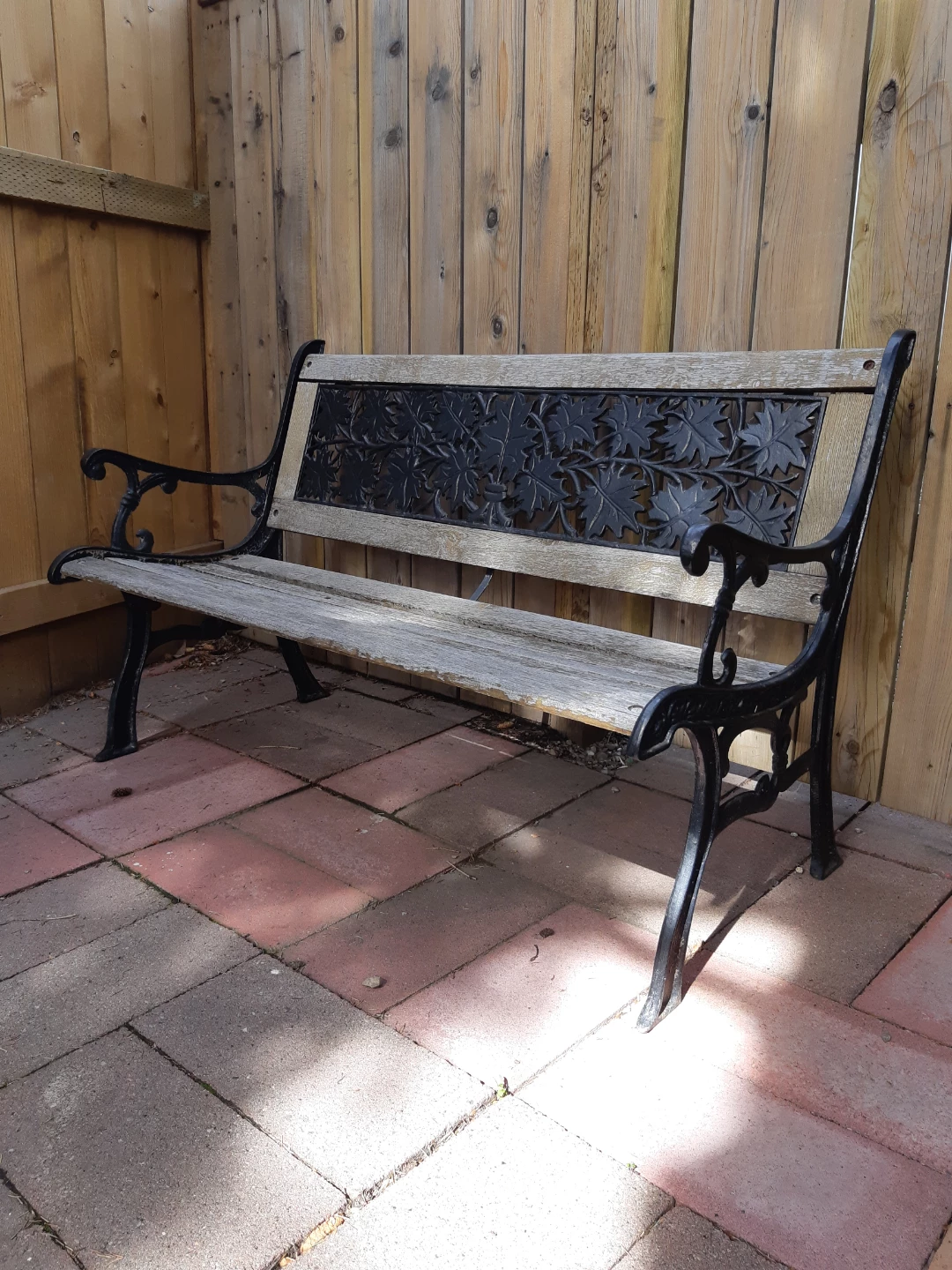 Rustic wooden wrought iron garden bench