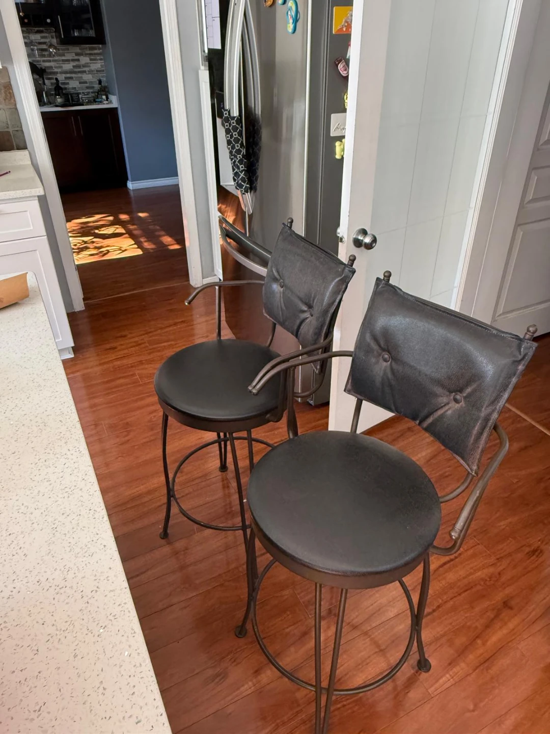 Two Metal Bar Stools with Padded Backs