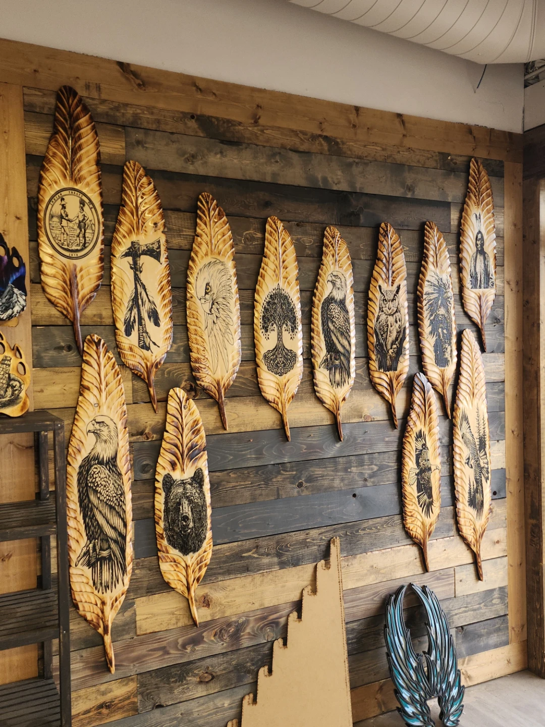 Hand-carved wooden feather wall decor