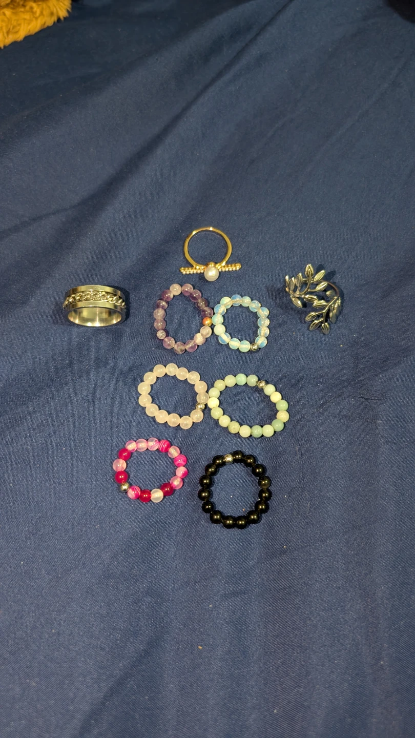 Assorted beaded bracelets and rings