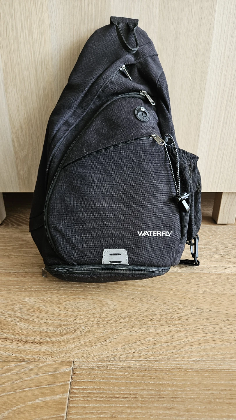 Waterfly black sling backpack
