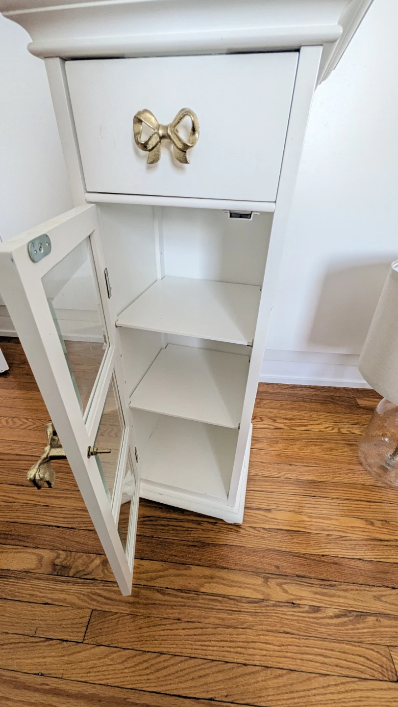 White storage cabinet with gold bow hardware - photo 2
