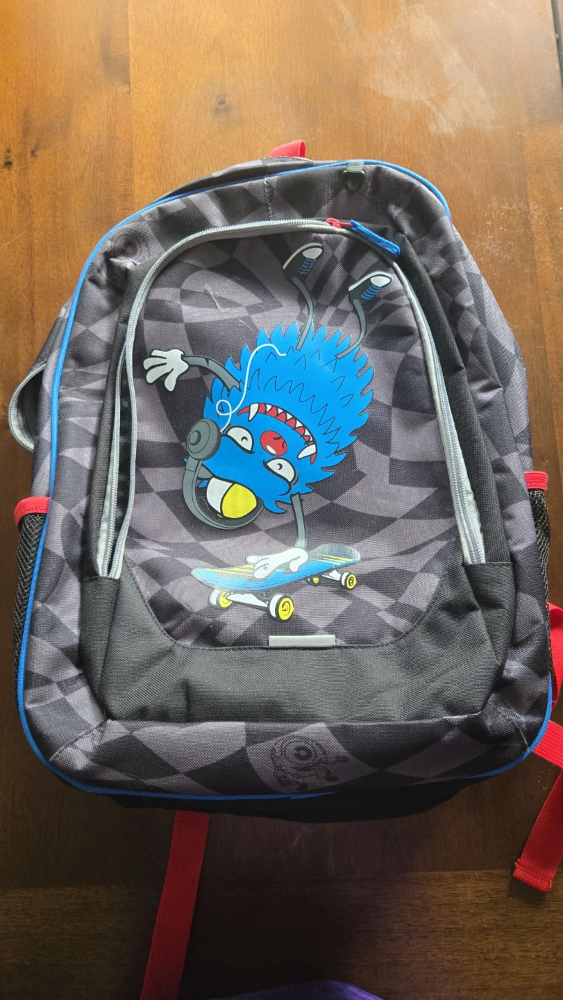 Backpack with fun monster graphic