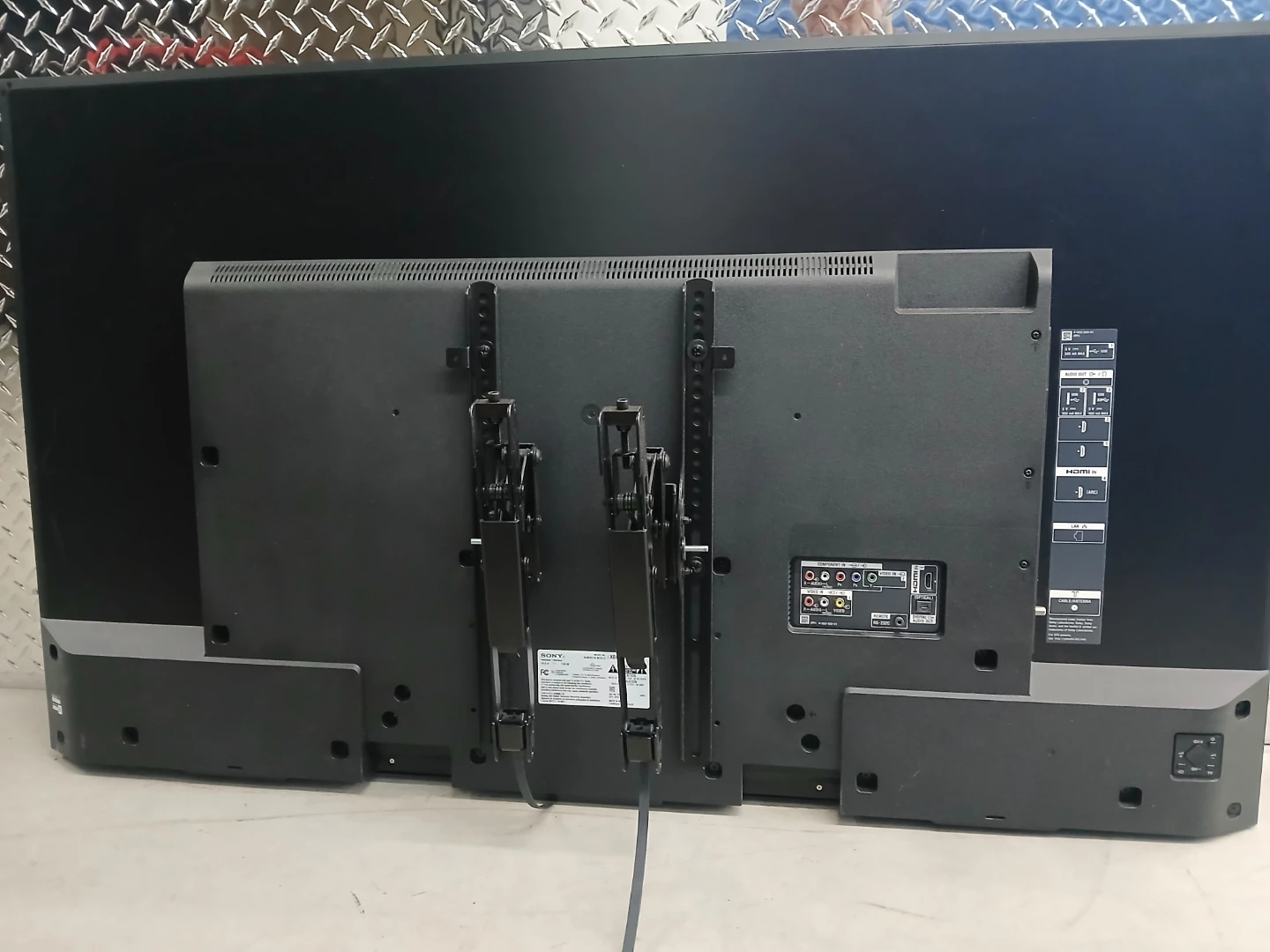 55 inch sony Bravia smart TV with a sanus tiltable wall mount