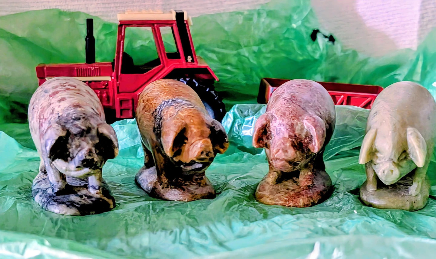 Herd of 4 Small Stone Pig Figurines