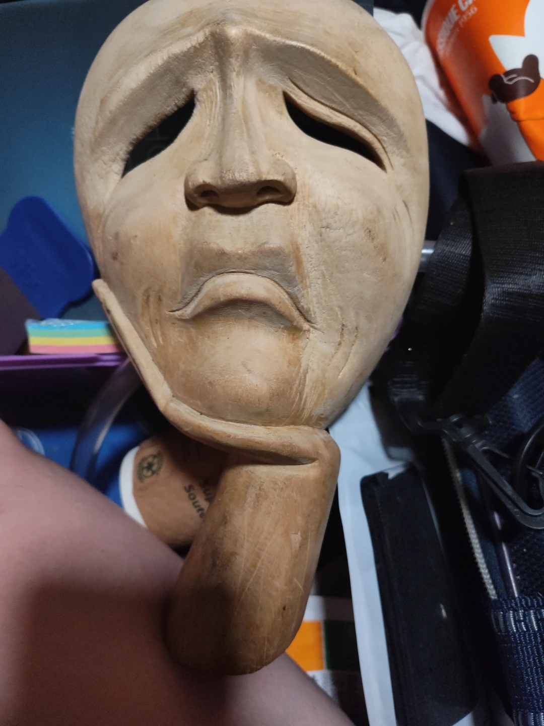 Hand-carved wooden face sculpture