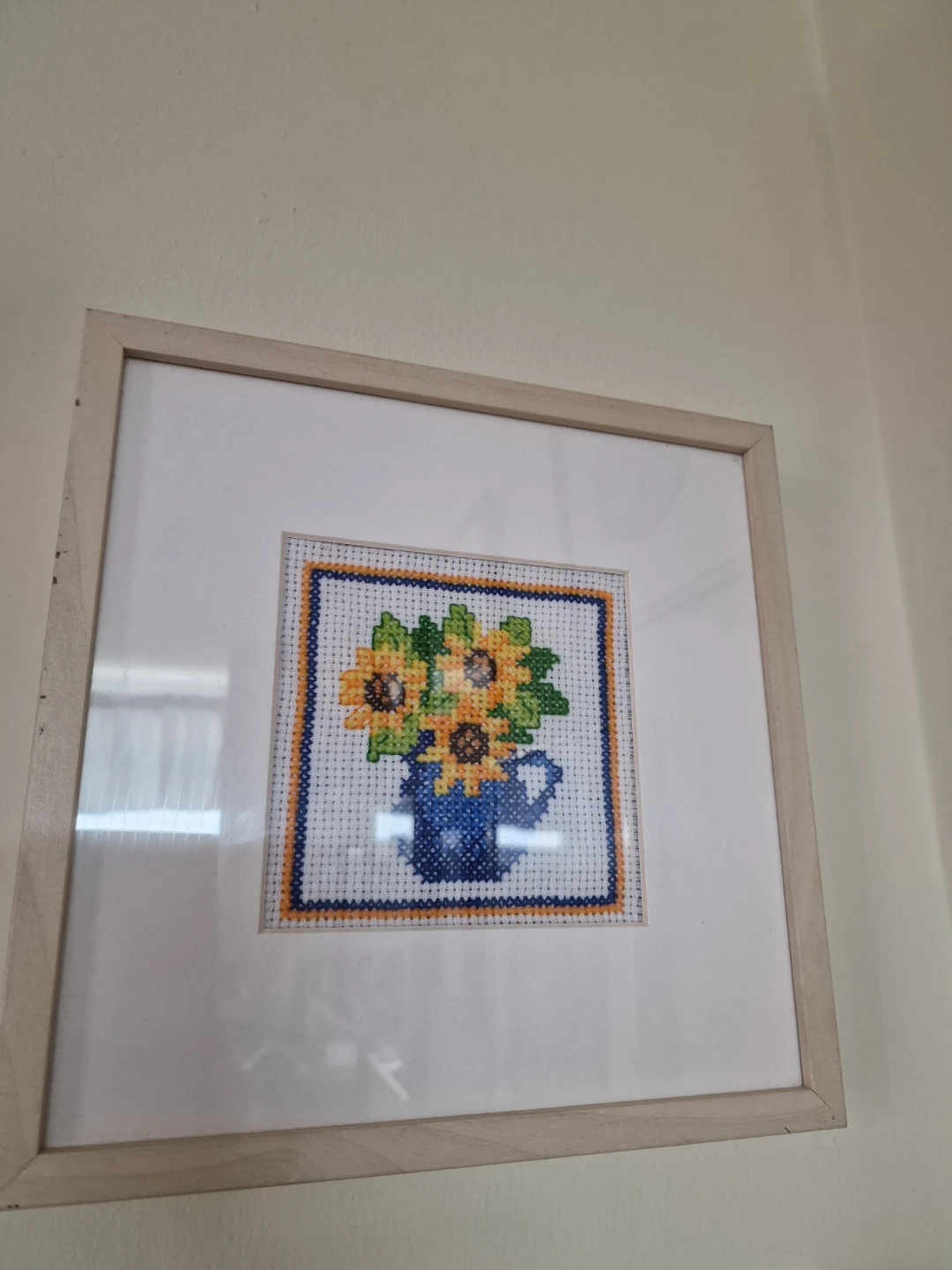 Set of two sunflower cross-stitch art pieces
