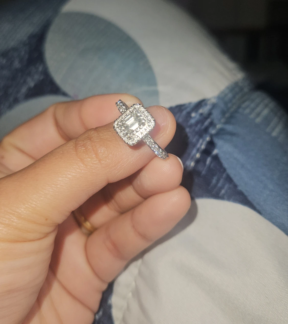 Emerald cut diamond ring with halo
