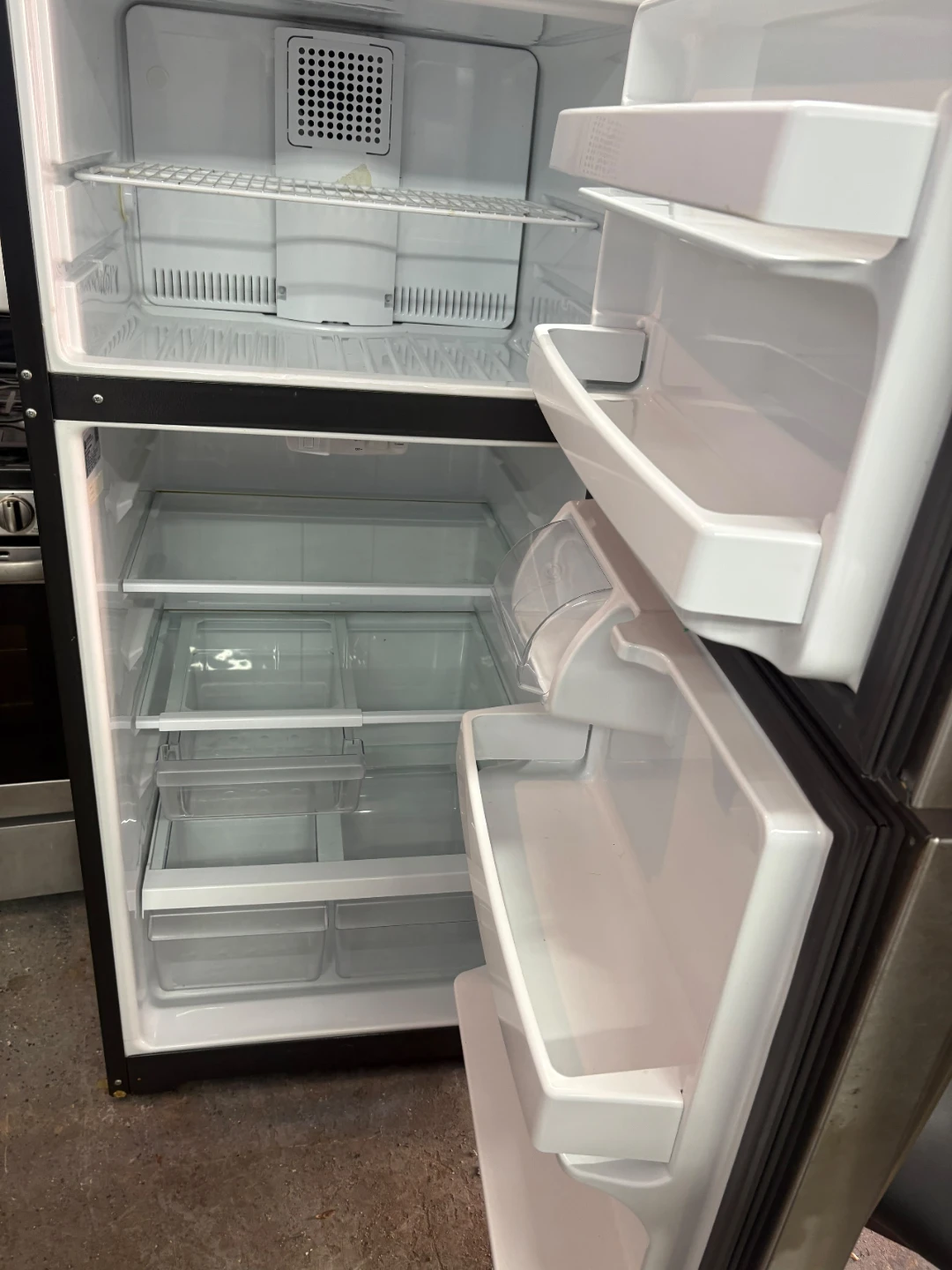 GE Stainless Steel Top Freezer Refrigerator - photo 2