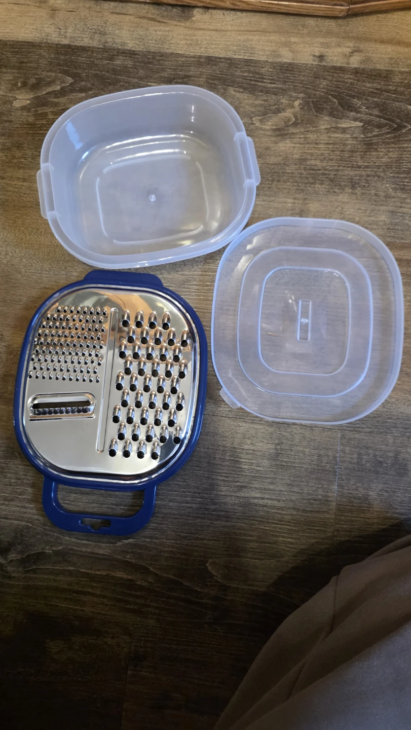 Kitchen grater with storage container