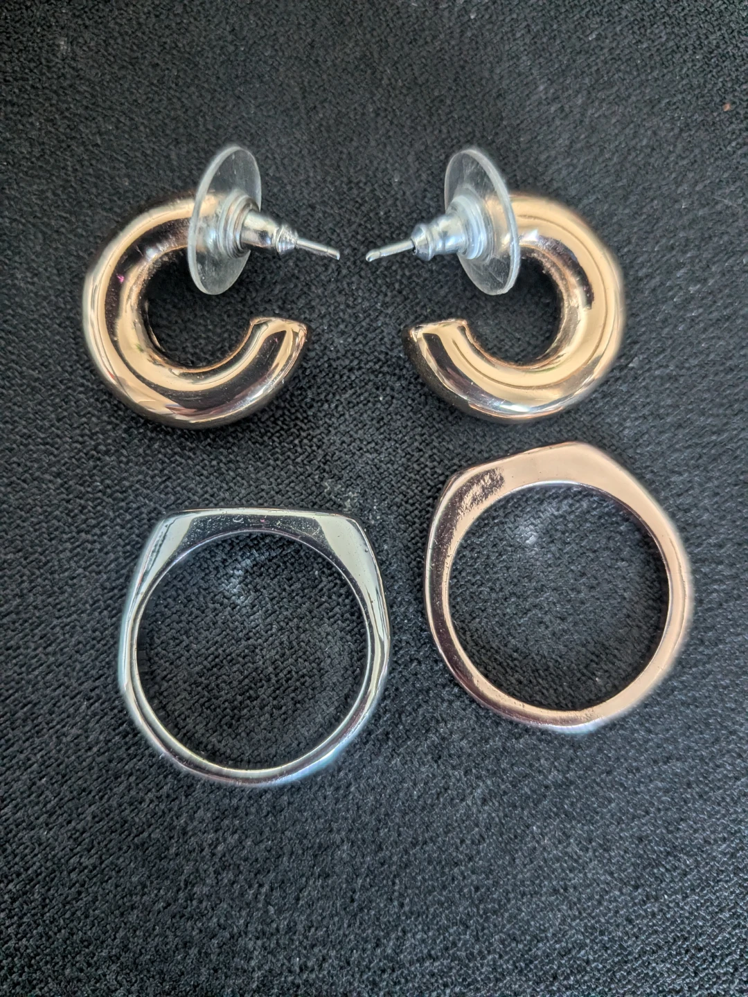 Gold-tone hoop earrings and two rings