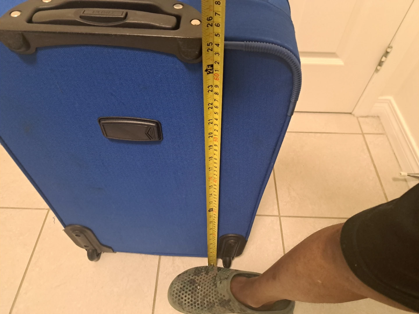 Blue rolling suitcase