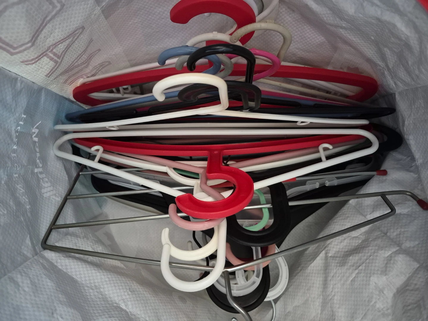 Assorted Plastic and Wire Clothes Hangers