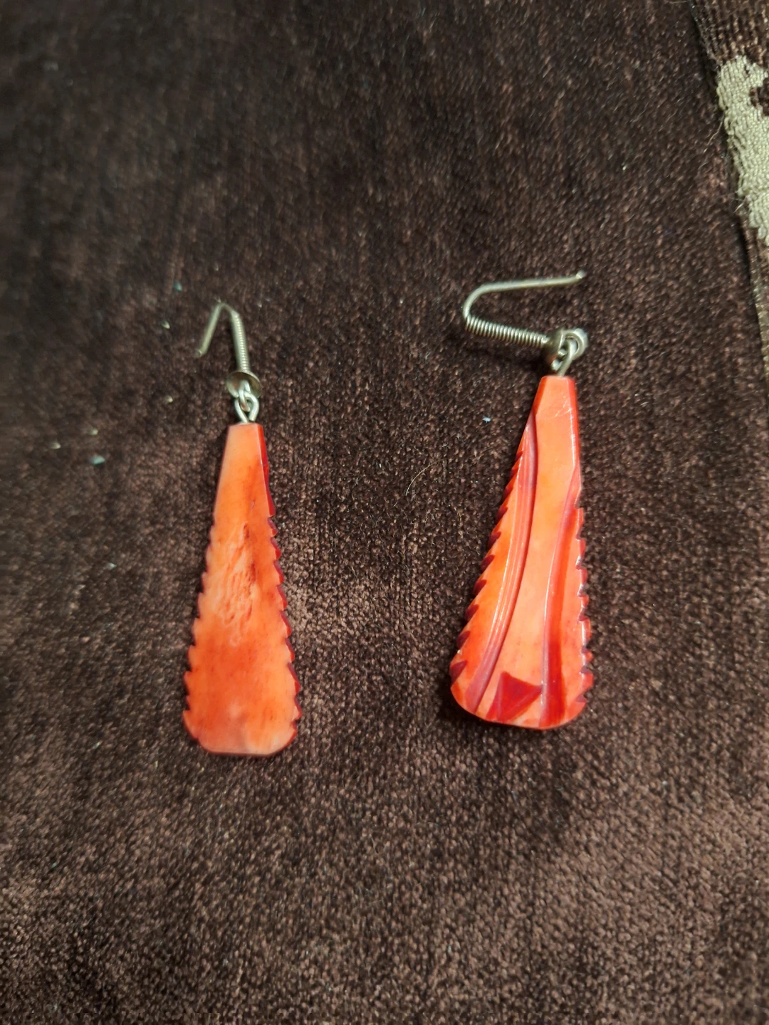 Orange carved dangle earrings