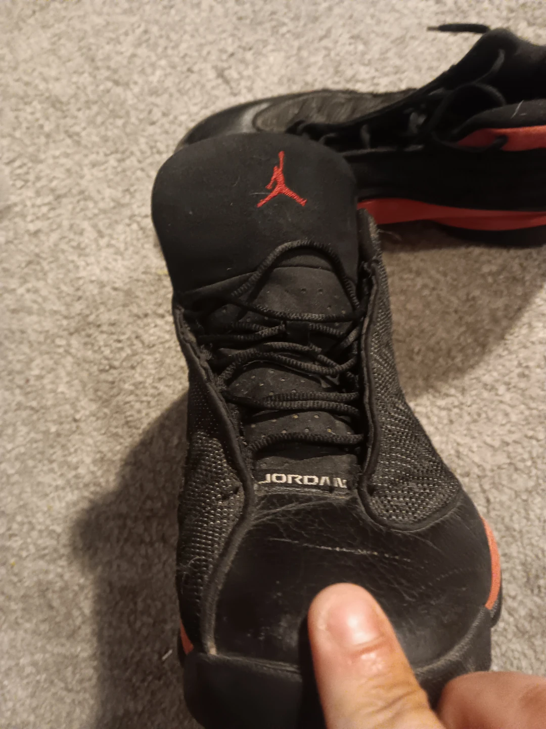 Jordan 13 Retro Black and Red Sneakers - photo 2