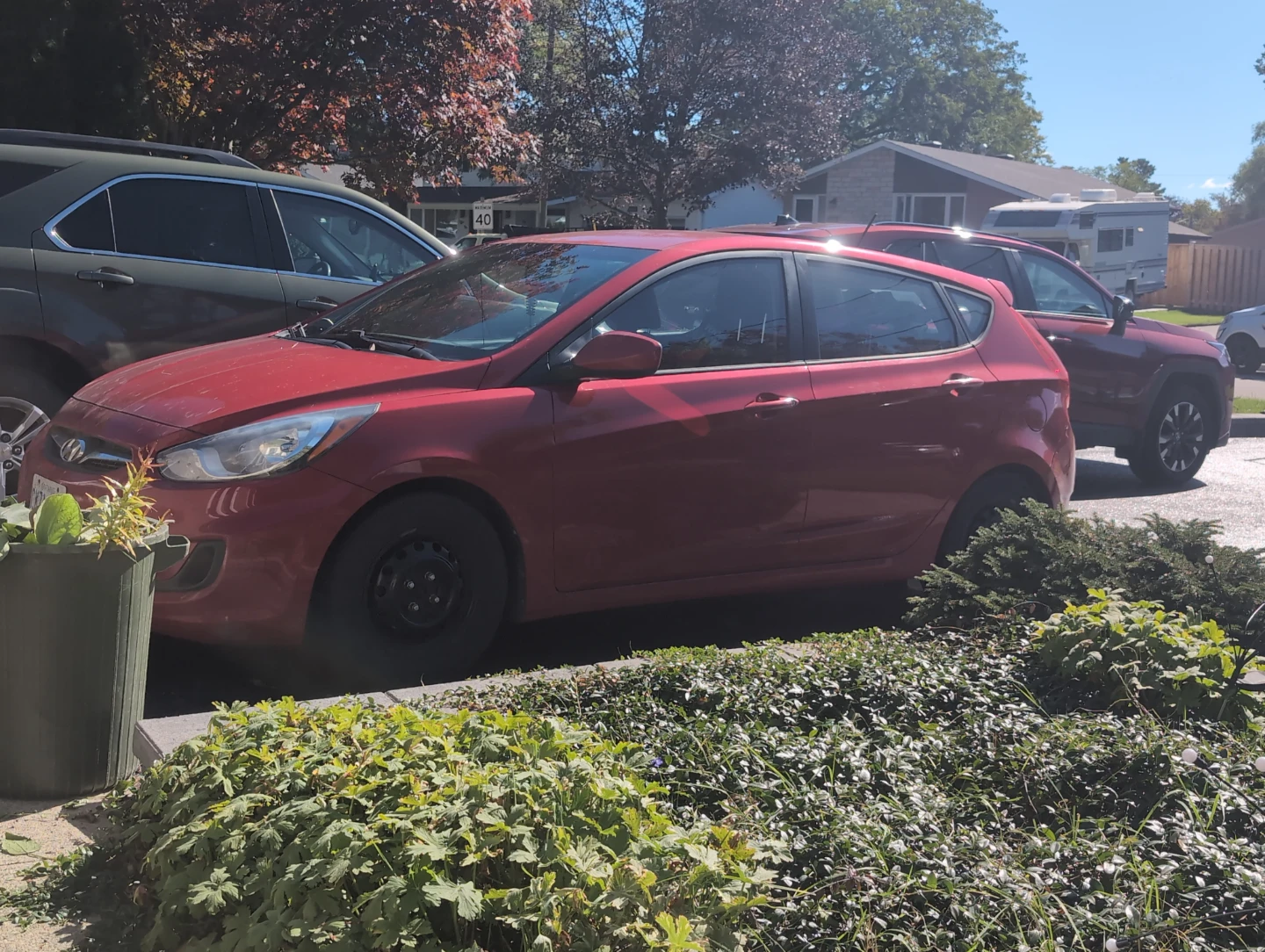 Red Hyundai Accent Hatchback
