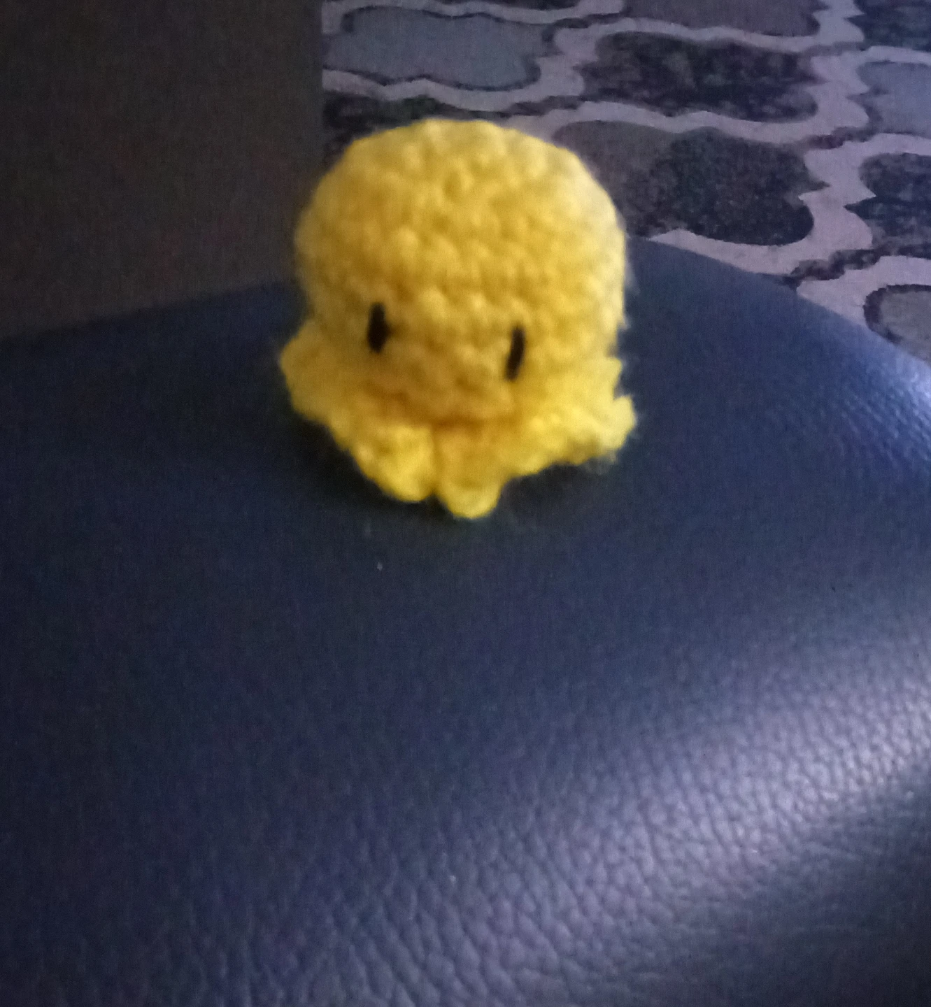 Small yellow crochet octopus plush