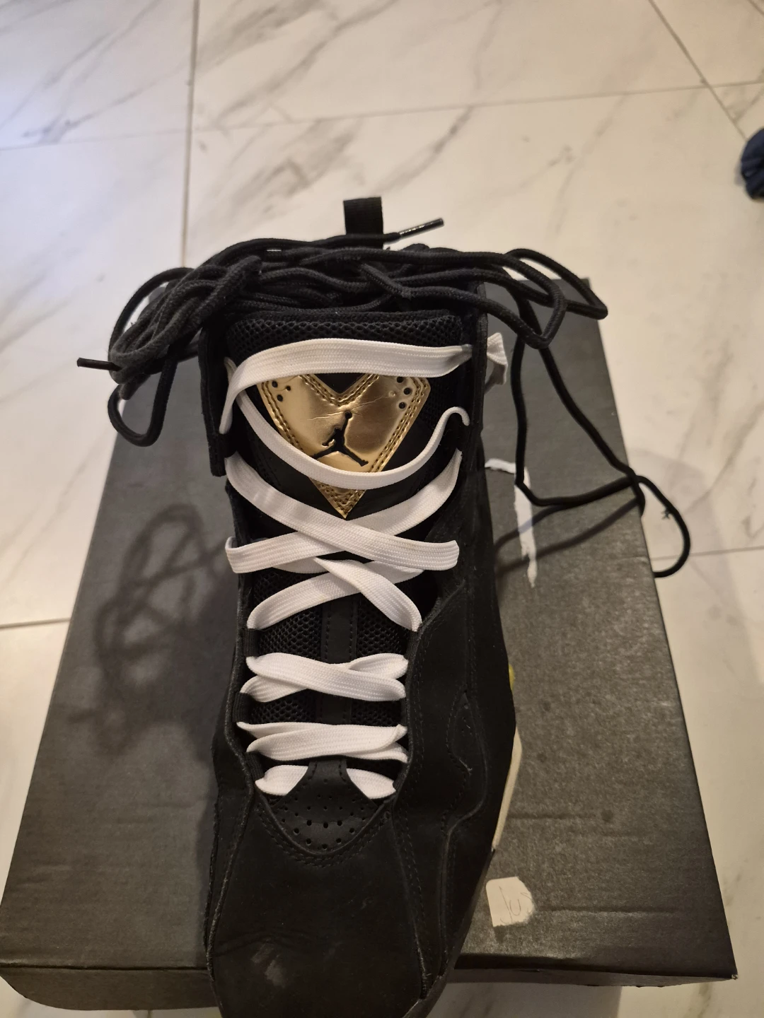 Air Jordan 7 Black and Gold Sneakers