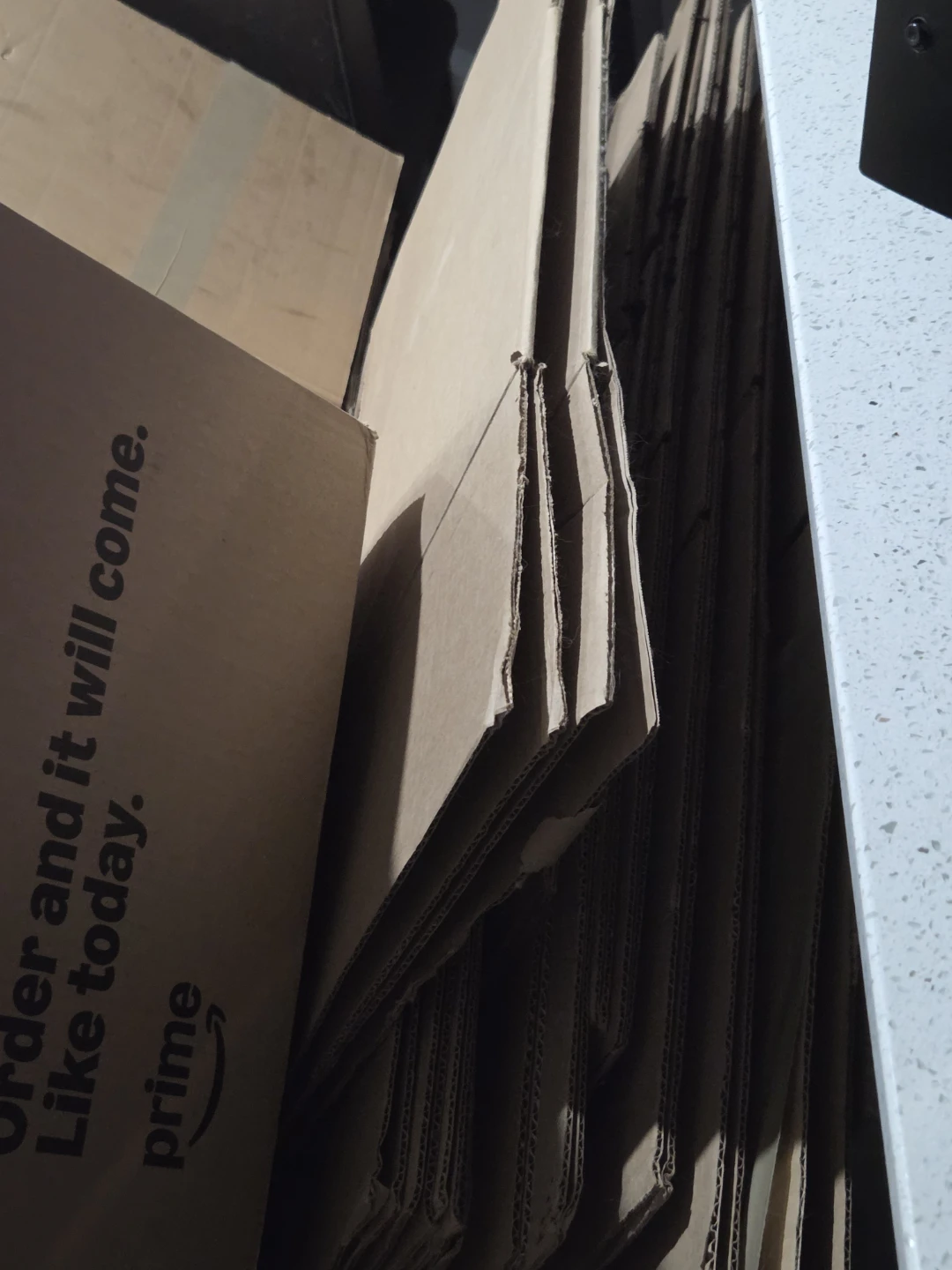 Assorted cardboard moving boxes