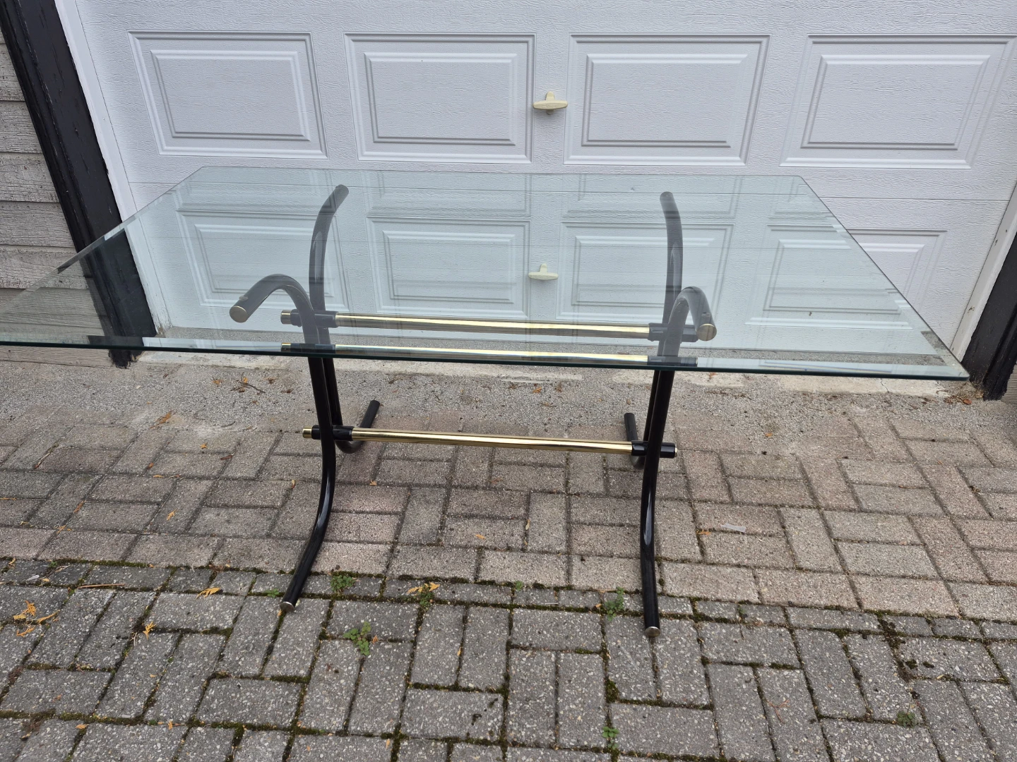 Glass top dining table with metal frame