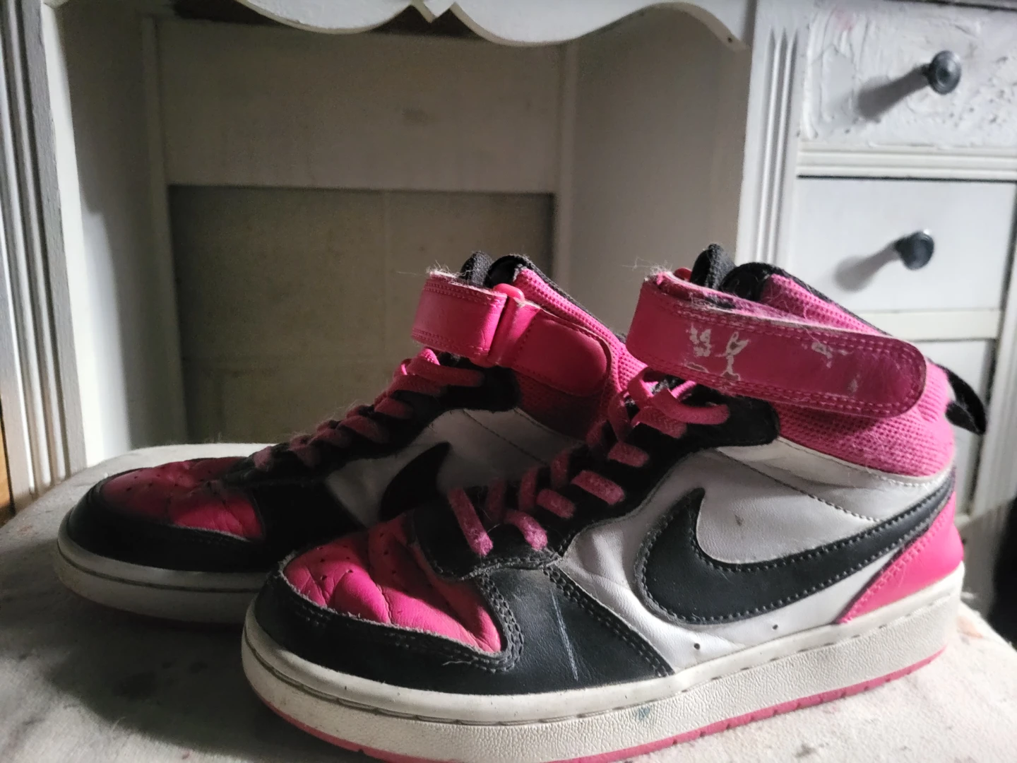 Pink high top Nike shoes