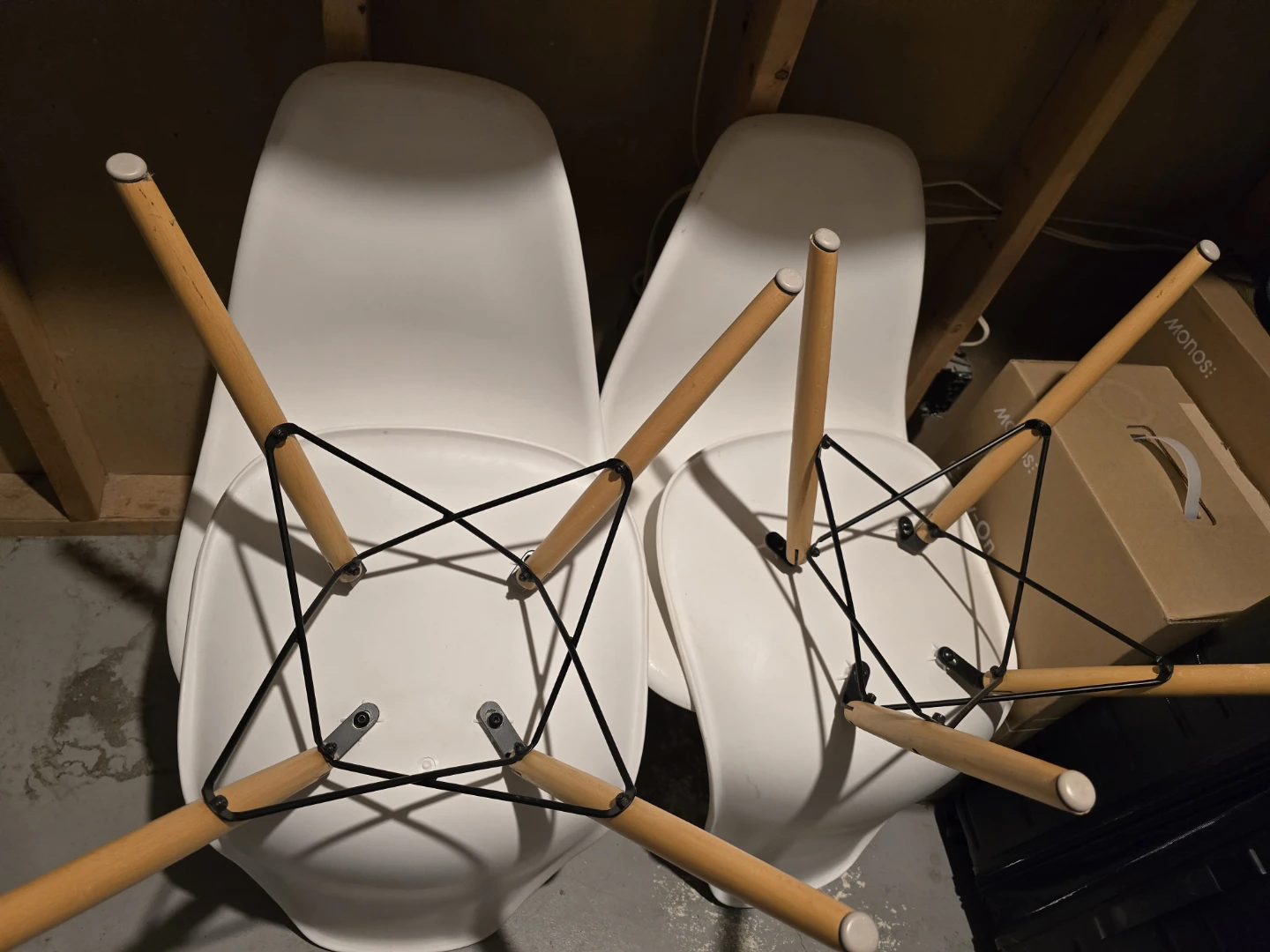 4 white Eames-style dining chairs