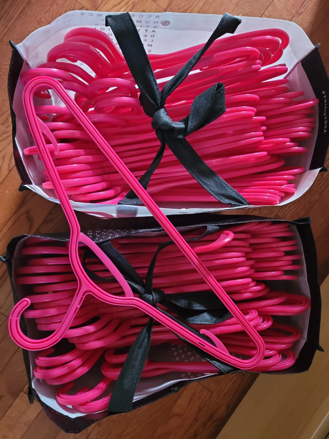 Lot of hot pink plastic clothes hangers (100)