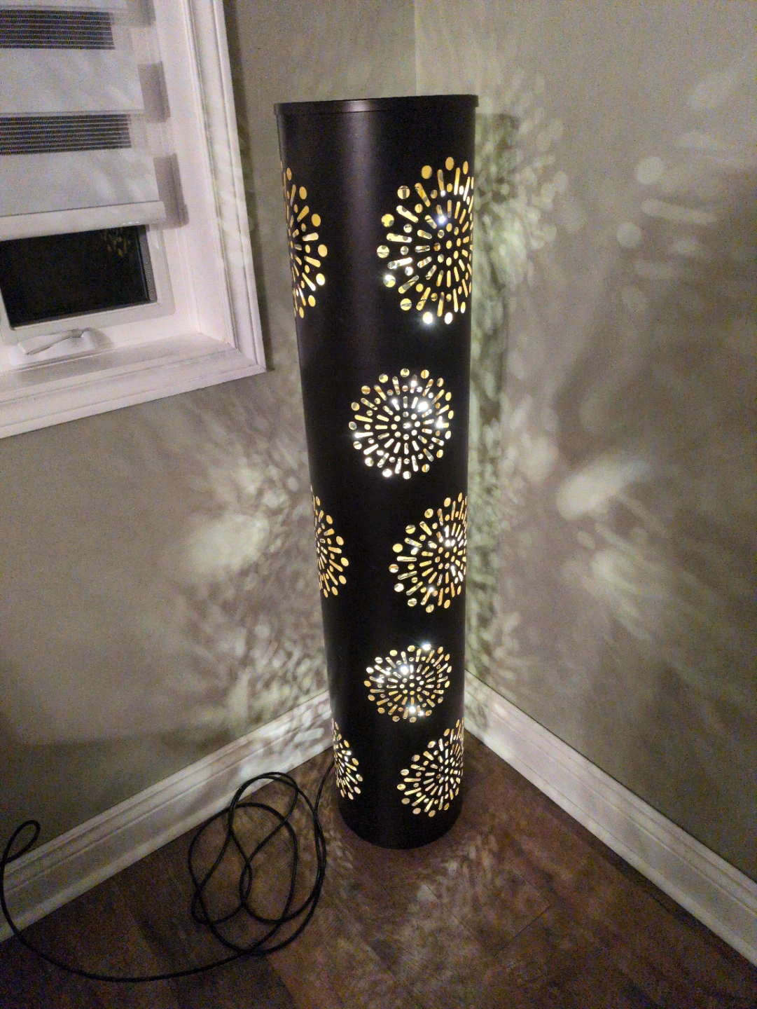 Black Cylindrical Floor Lamp with Cut-Out Pattern